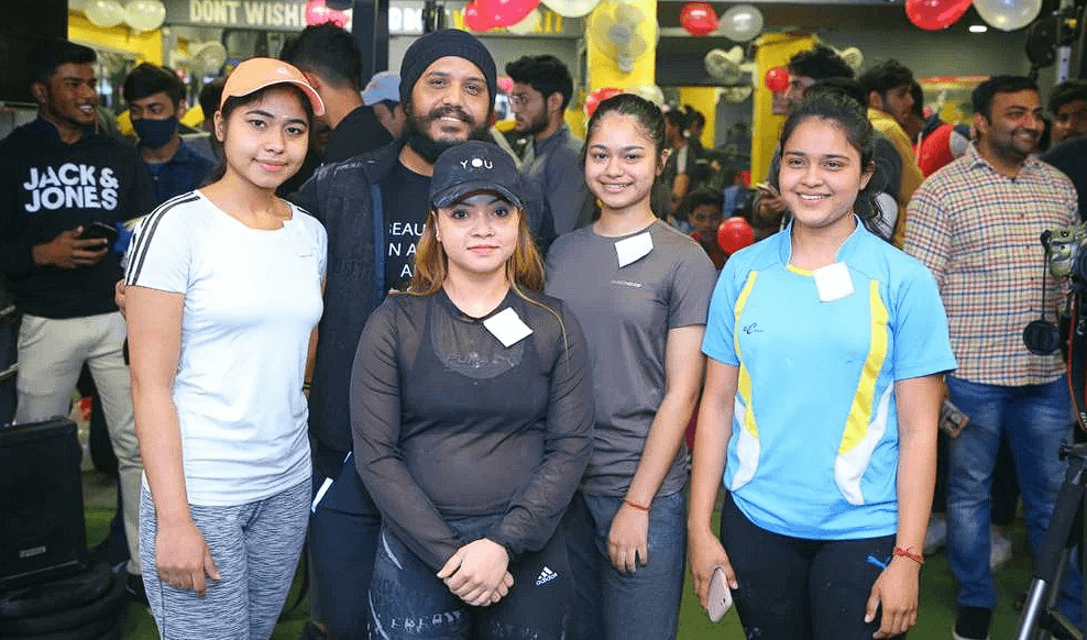 Happy clients working out in the gym